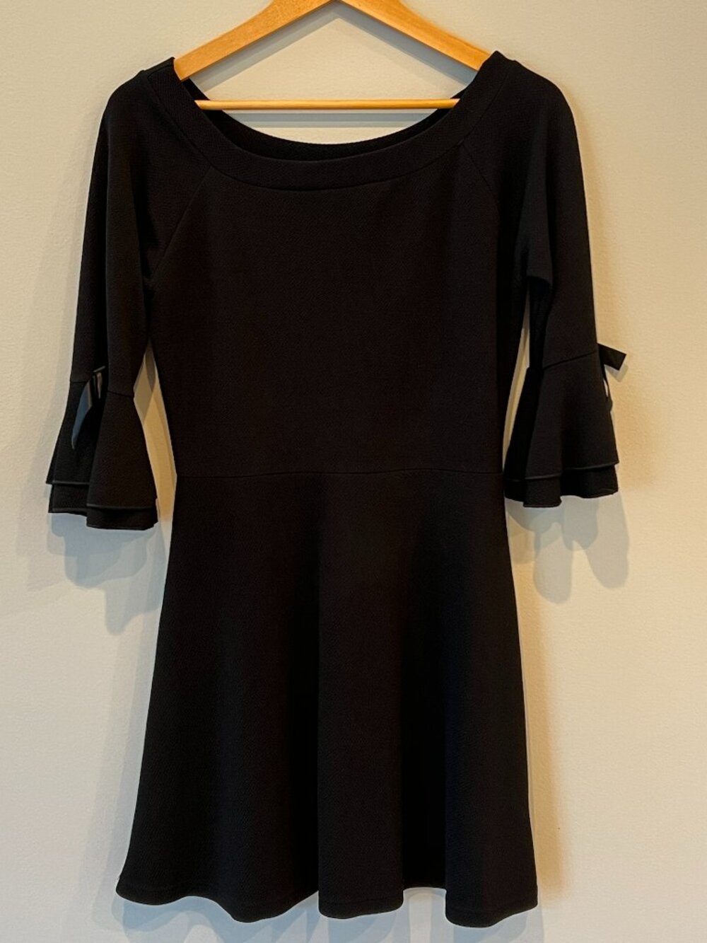 Questions Little Black Dress with Bow Sleeve Details – Scoop Neck – Size M
